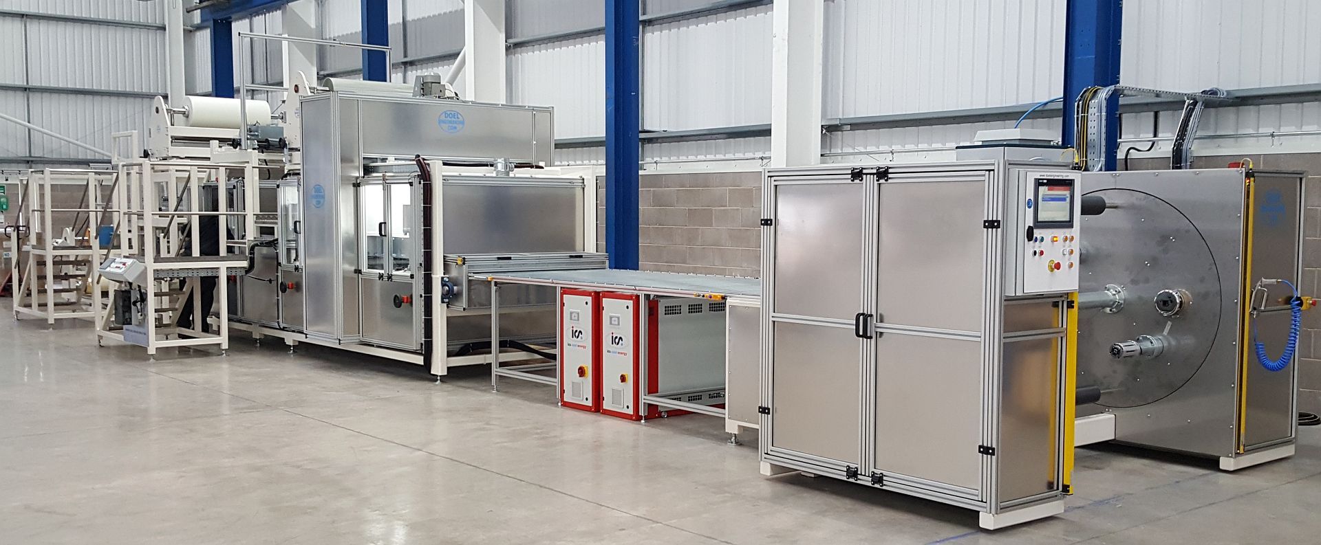 A PE resin coater and laminator for glass fibre material with a dual spindle turret rewind system. A PE resin coater and laminator for glass fibre material with a dual spindle turret rewind system.