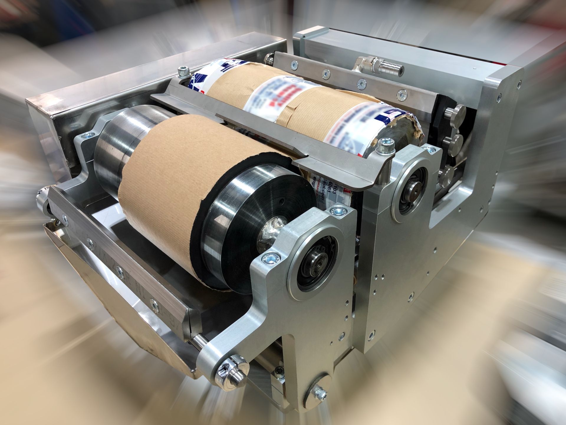 A modular gravure coating head for pre-print and post-print lacquer application on aluminium cans. A modular gravure coating head for pre-print and post-print lacquer application on aluminium cans.